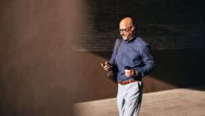 Man on phone symbolizing researching of Restricted Stock Units or RSUs