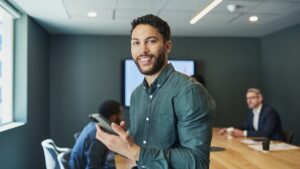 Image of a man with a phone symbolizing Want to Execute Your Own Liquidity Program