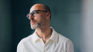 Man looking off symbolizing What Law Firms Need to Understand About Secondaries – Beyond the Private Company Tender Offer