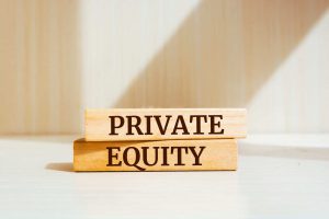 Wooden blocks labeled 'Private Equity,' symbolizing private market investments