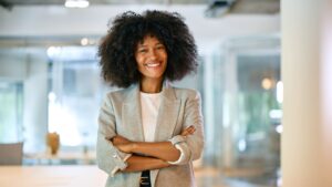 Image of a woman looking confident to symbolize How Employees Sell Private Company Shares in the Secondary Market